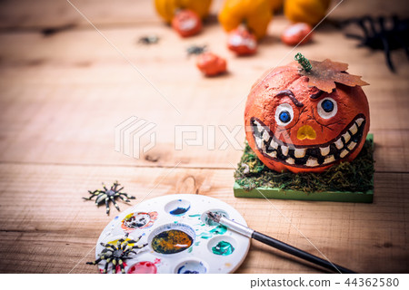 Happy Halloween. painting scary pumpkin for party 44362580