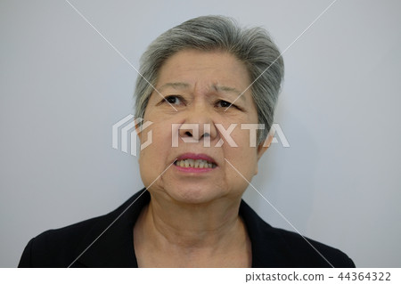 furious elder woman, enraged elderly female. angry senior 44364322
