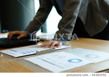 man using computer. businessman working with financial graph chart 44364592
