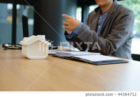 real estate agent realtor with house model & dollar banknote. buying selling renting property 44364712