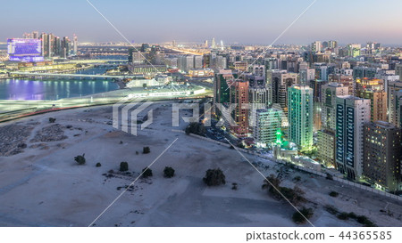 Aerial skyline of Abu Dhabi city centre from above day to night timelapse 44365585