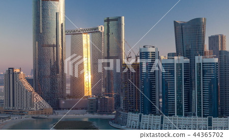 Buildings on Al Reem island in Abu Dhabi timelapse from above. 44365702