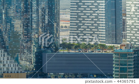 Buildings on Al Reem island in Abu Dhabi timelapse from above. 44365791