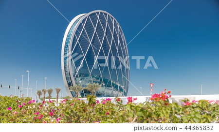 Circular skyscraper Aldar Headquarters Building timelapse in Abu Dhabi, UAE. Circular skyscraper Aldar Headquarters Building timelapse in Abu Dhabi, UAE. 44365832