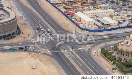 Top view city traffic on a crossroad in Dubai Downtown timelapse. 44365843