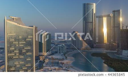 Buildings on Al Reem island in Abu Dhabi timelapse from above. 44365845