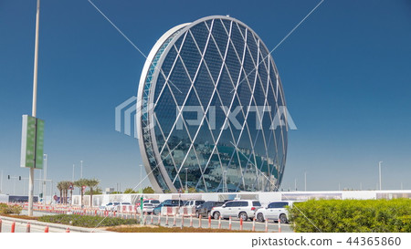 Circular skyscraper Aldar Headquarters Building timelapse in Abu Dhabi, UAE. Circular skyscraper Aldar Headquarters Building timelapse in Abu Dhabi, UAE. 44365860