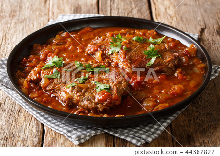 smothered beef steak cooked in tomato sauce smothered beef steak cooked in tomato sauce 44367822