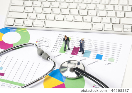 Miniature businessman with graph and cheer 44368387