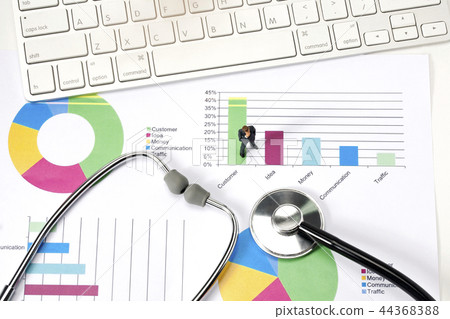 Miniature businessman with graph and cheer Miniature businessman with graph and cheer 44368388