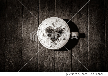 cup of coffee with a heart of cinnamon on a wooden table cup of coffee with a heart of cinnamon on a wooden table 44369219