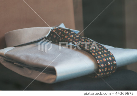 blue shirt and tie in a fashion store showroom blue shirt and tie in a fashion store showroom 44369672
