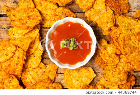 Tortilla snacks with tomato sauce 44369744