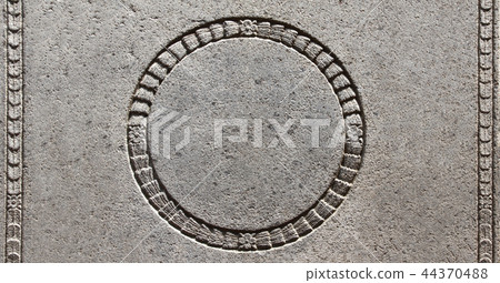 Detail of an ancient carved stone frame  44370488