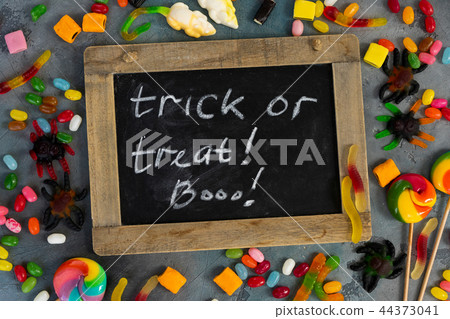 Colorful halloween candies on stone 44373041