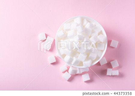Sugar on pink background Sugar on pink background 44373358
