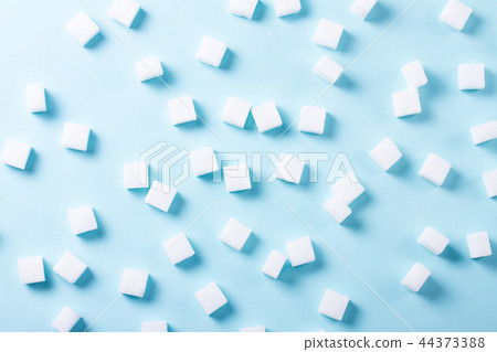 Sugar on blue background Sugar on blue background 44373388