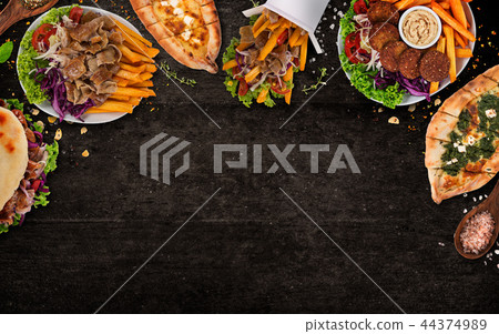 Top down view on traditional turkish meals on black stone table. 44374989