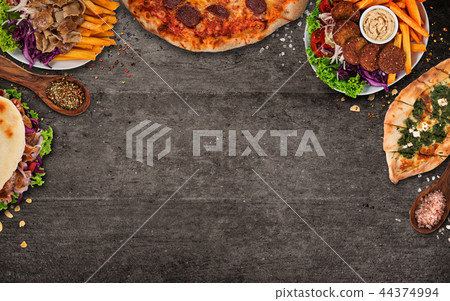 Top down view on traditional turkish meals on black stone table. 44374994