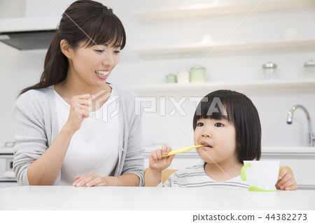 3-year-old girl brushing teeth 3-year-old girl brushing teeth 44382273