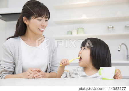 3-year-old girl brushing teeth 3-year-old girl brushing teeth 44382277
