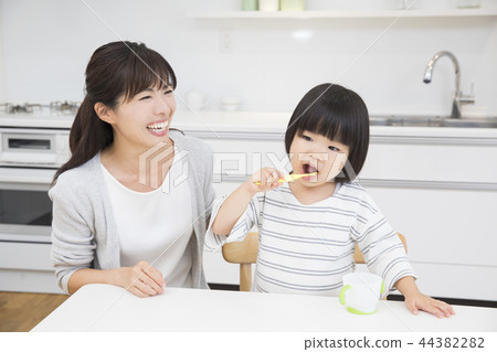 3-year-old girl brushing teeth 3-year-old girl brushing teeth 44382282