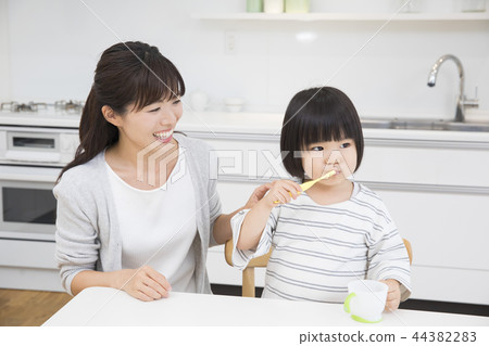 3-year-old girl brushing teeth 3-year-old girl brushing teeth 44382283