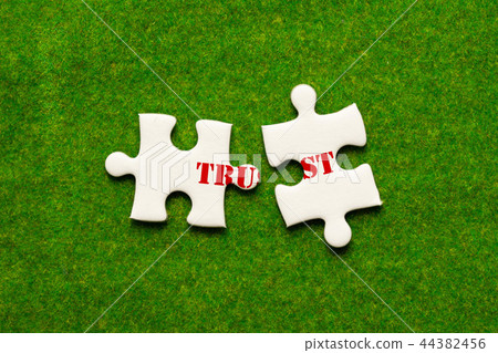 separate two jigsaw puzzle with trust wording 44382456