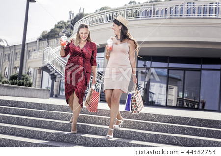 Delighted nice women going down the stairs 44382753