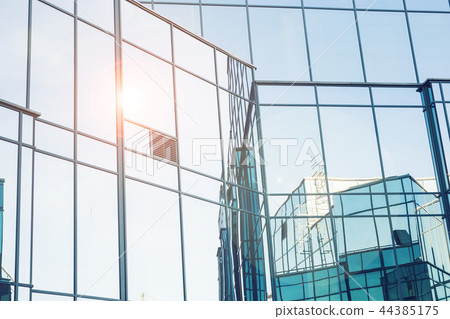 Modern buildings, business and architecture concept - Sunlight reflected on office building. 44385175