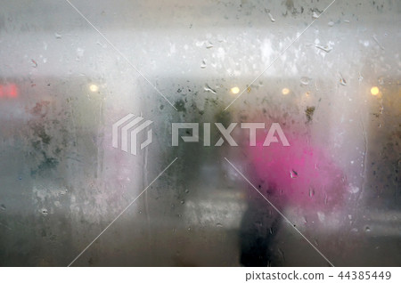 Raindrops on misted glass. Raindrops on misted glass. 44385449
