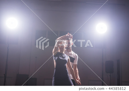 Young couple dancing latin dance Bachata, merengue, salsa. Two elegance pose in dance class 44385812