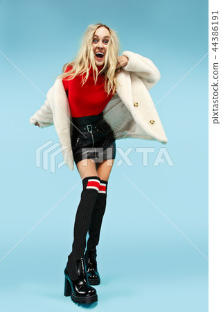 Full-length portrait young elegant woman at studio. Female fashion and shopping concept Full-length portrait young elegant woman at studio. Female fashion and shopping concept 44386191