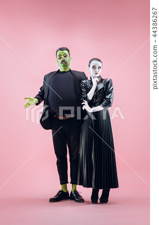 Halloween Family. Happy couple in Halloween Costume and Makeup Halloween Family. Happy couple in Halloween Costume and Makeup 44386267