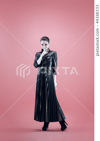 Halloween. Beautiful woman with bright black halloween makeup, black and white Halloween. Beautiful woman with bright black halloween makeup, black and white 44386533