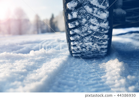 Closeup of car tires in winter Closeup of car tires in winter 44386930