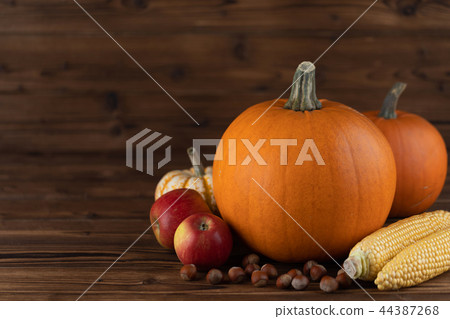 Autumn harvest on wooden table 44387268