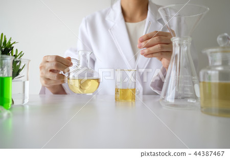 doctor woman scientist making herbal medicine. doctor woman scientist making herbal medicine. 44387467