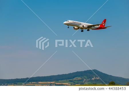 Helvetic Swiss airlines airplane preparing for landing at day time in international airport 44388453