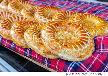 Baked traditional uzbek round flatbread Baked traditional uzbek round flatbread 44388610
