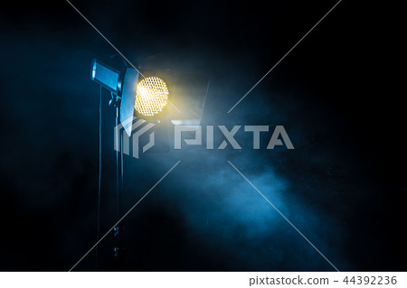 Theater spot light on black background. 44392236