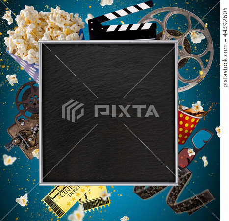 Cinema concept of vintage film reels, clapperboard and other tools. 44392605