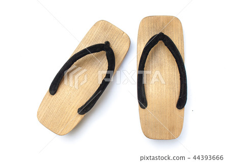 Old wooden Japanese sandal on white background. Old wooden Japanese sandal on white background. 44393666