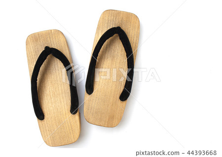 Old wooden Japanese sandal on white background. 44393668