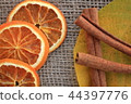 Dried orange slices with cinnamon and autumn leaf 44397776