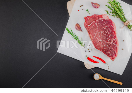 Fresh beef fillet with ingredients in cooking Fresh beef fillet with ingredients in cooking 44399149