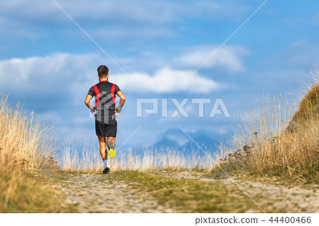 Runner on mountain road trains Runner on mountain road trains 44400466