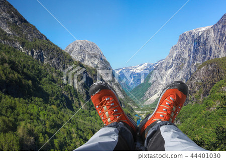 Valley with hiking boots close the Flam in Norway Valley with hiking boots close the Flam in Norway 44401030
