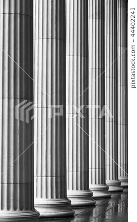 Many old greek columns with reflection 44402241