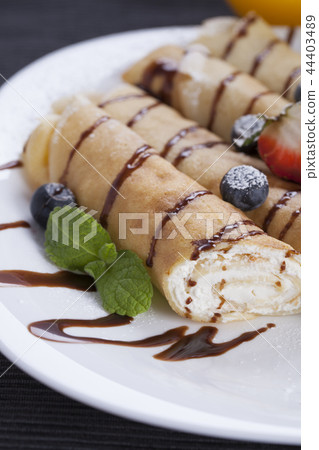 Delicious sweet rolled pancakes Delicious sweet rolled pancakes 44403489